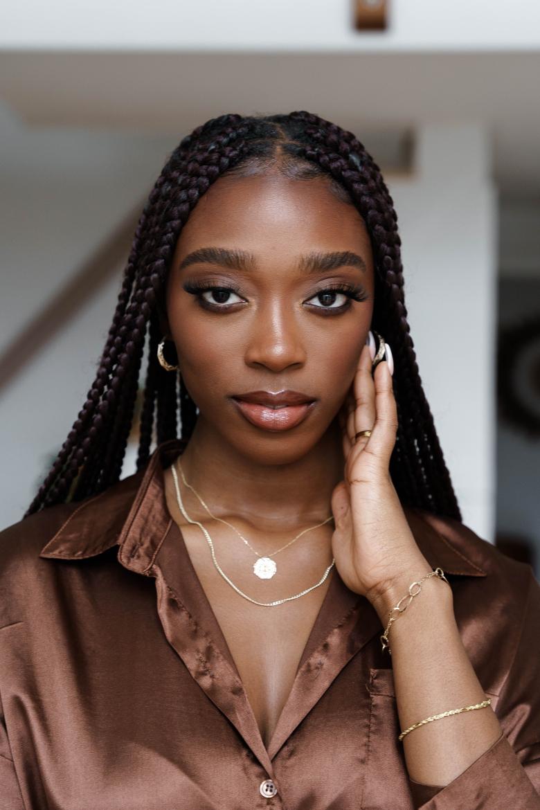 young woman wearing tuscany gold jewelry 