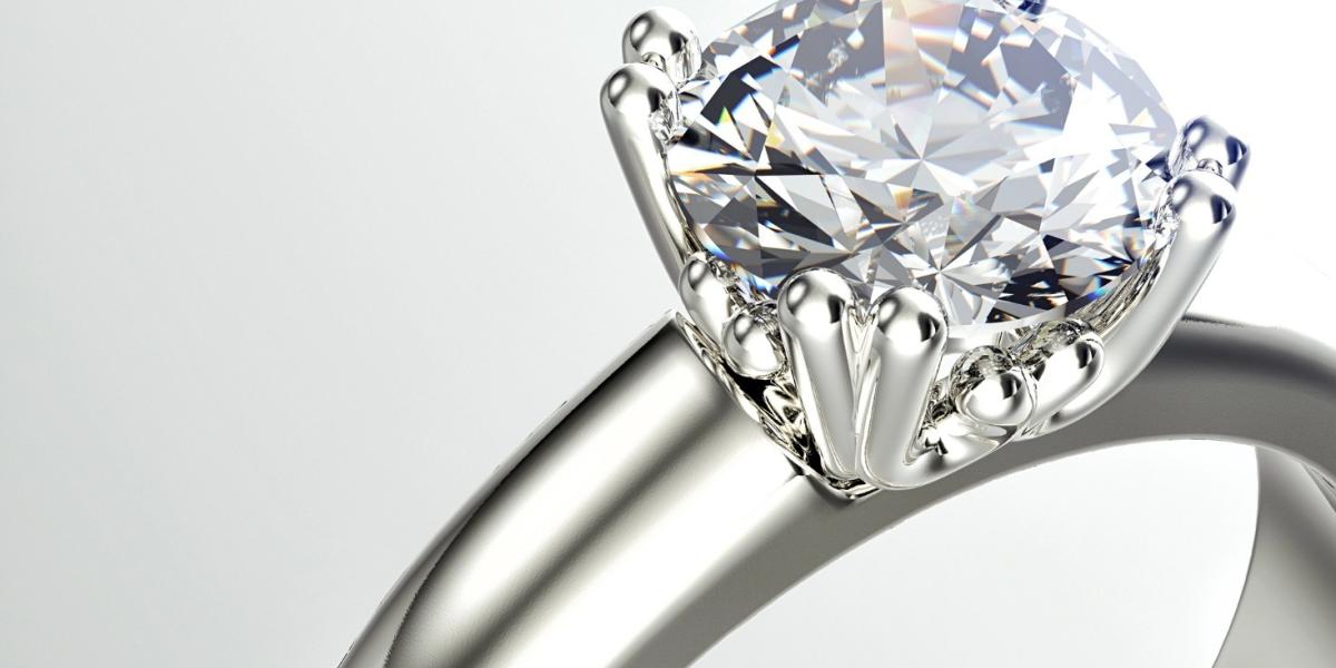 Diamond engagement rings displayed in white gold and yellow-gold settings